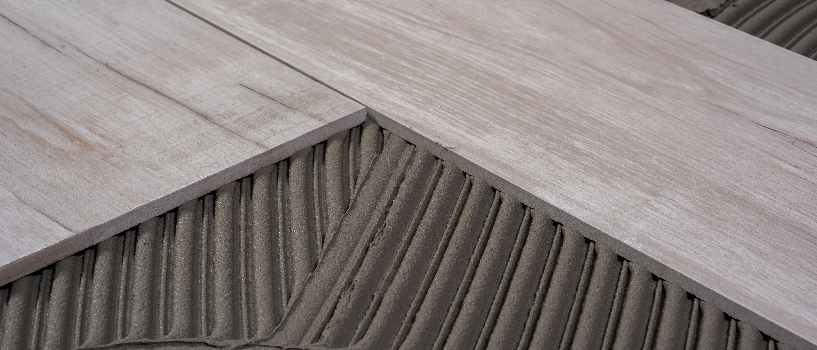 Adhesives and grouts for tiling